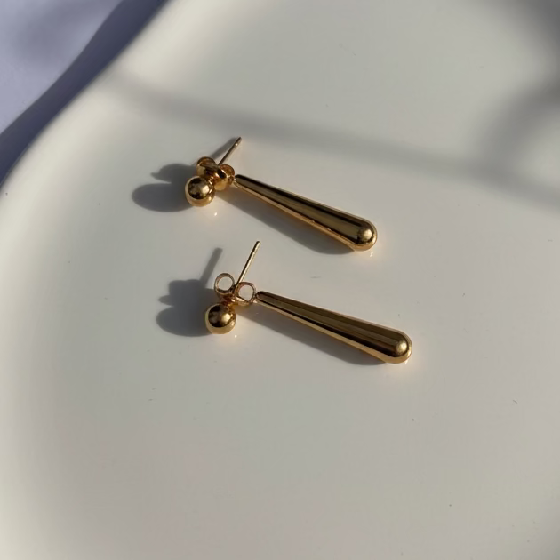 Gold teardrop design earrings