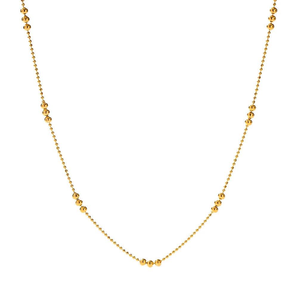 Gold-plated beaded necklace with a delicate and elegant design.