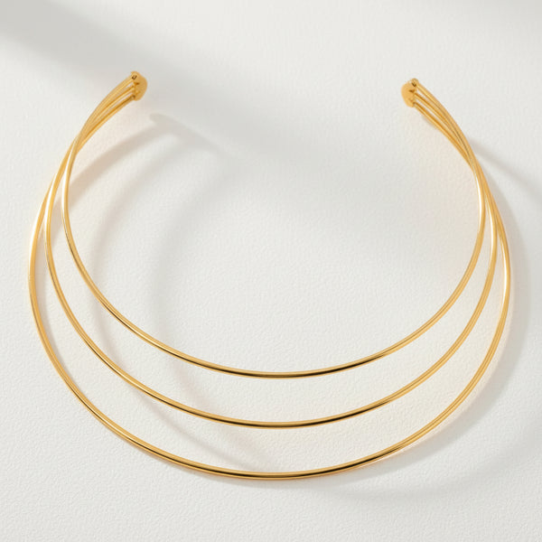 Gold necklace cuff with three circular links 