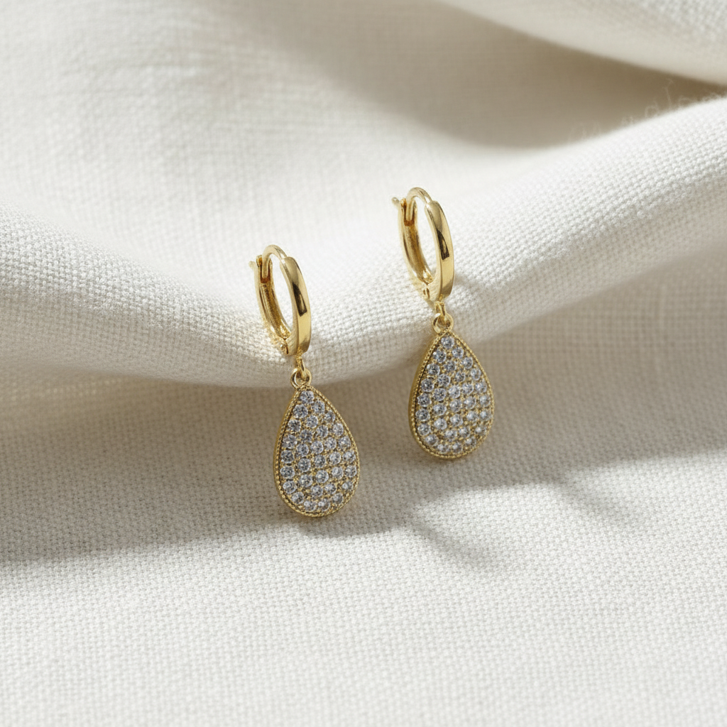 Gold-plated teardrop earrings with zircon crystals.