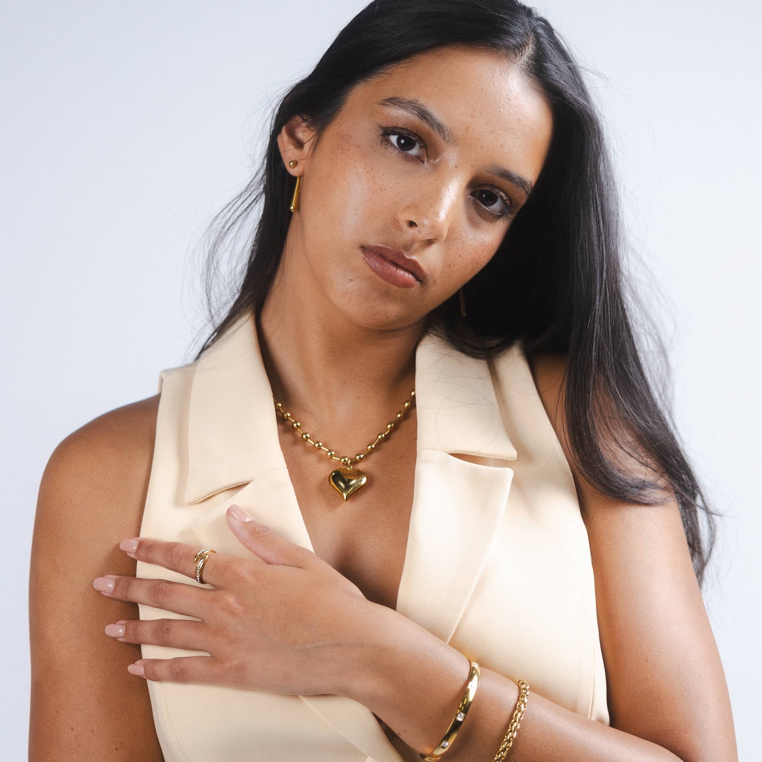 Woman wearing gold necklace