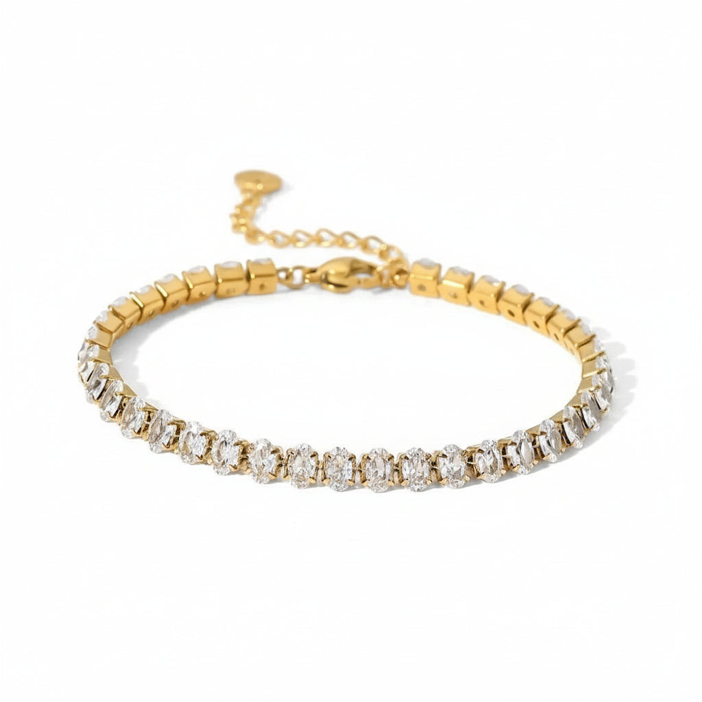 A gold-plated bracelet with oval-cut stones