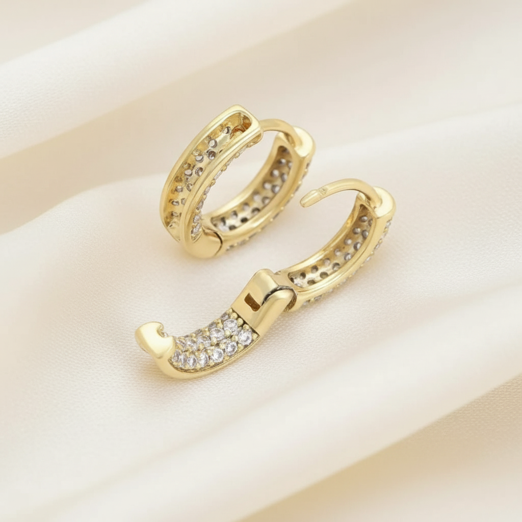 Gold hoop earrings with embedded zircon crystals